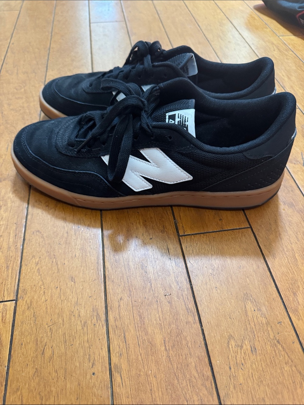 New Balance Men’s Black Suede Sneakers with White Logo and Gum Sole